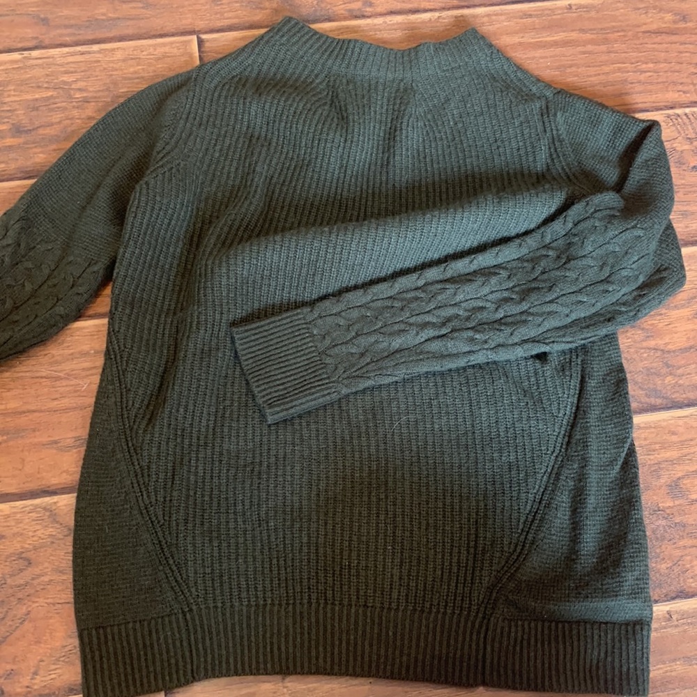 green knitted sweater